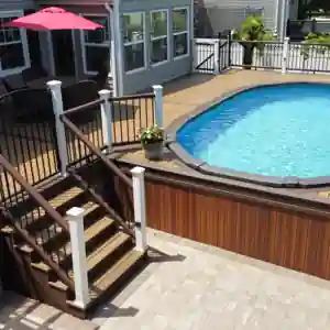 Composite deck built around an above-ground swimming pool with contrasting railing and multiple stair levels