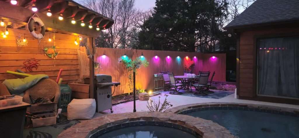Govee outdoor lighting illuminating a backyard pool area at night